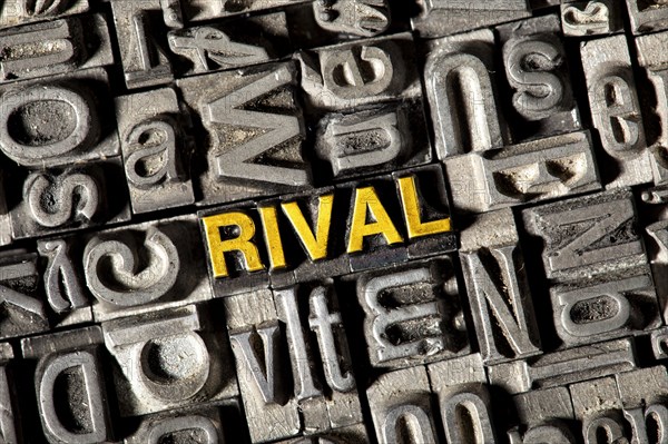 Old lead letters forming the word "RIVAL"