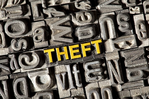 Old lead letters forming the word 'THEFT'