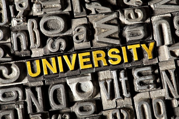 Old lead letters forming the word University