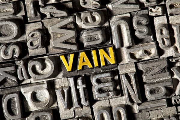 Old lead letters forming the word Vain