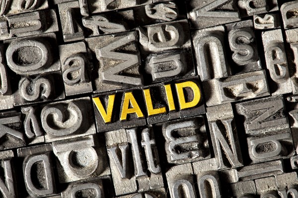 Old lead letters forming the word Valid