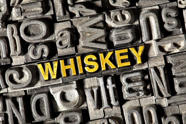 Old lead letters forming the word Whiskey