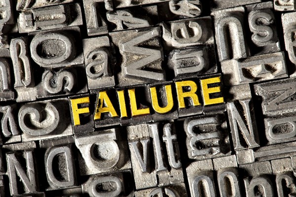 Old lead letters forming the word Failure