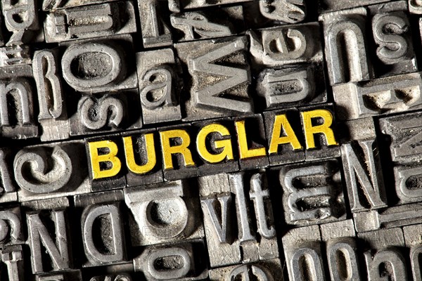 Old lead letters forming the word Burglar