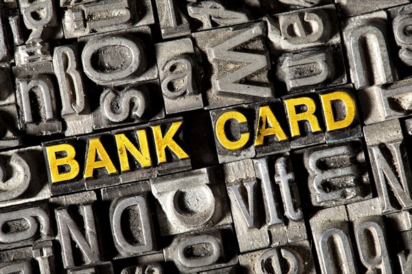 Old lead letters forming the words "BANK CARD"