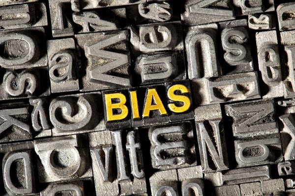Old lead letters forming the word 'BIAS'