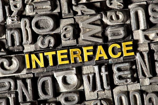 Old lead letters forming the word Interface