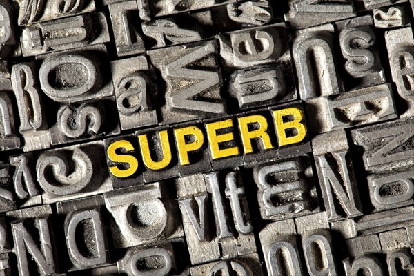 Old lead letters forming the word Superb