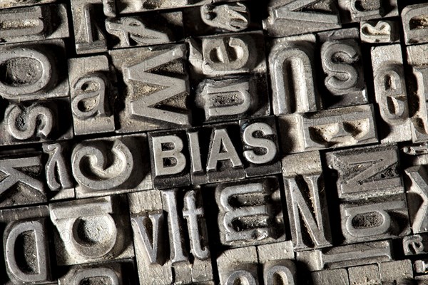 Old lead letters forming the word 'BIAS'