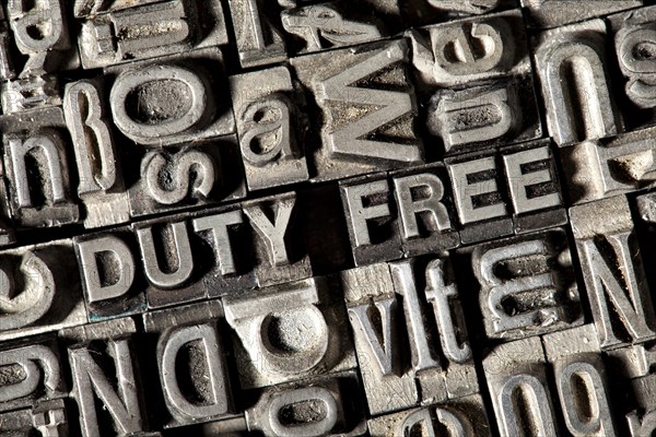 Old lead letters forming the term DUTY FREE