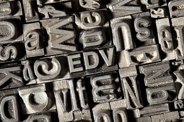 Old lead letters forming the acronym EDV