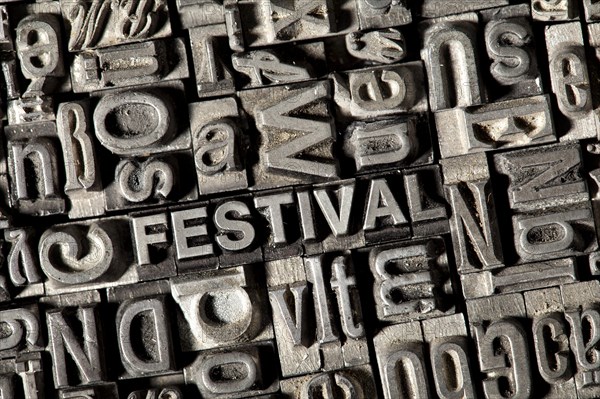 Old lead letters forming the word FESTIVAL