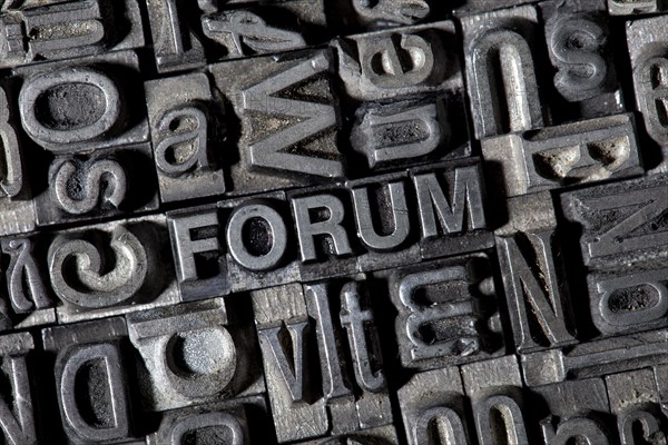 Old lead letters forming the word FORUM