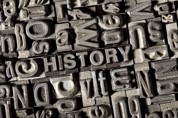 Old lead letters forming the word HISTORY
