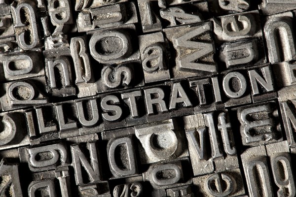 Old lead letters forming the word ILLUSTRATION