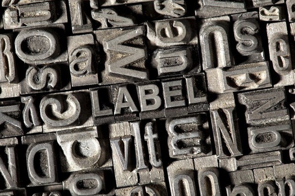 Old lead letters forming the word 'LABEL'
