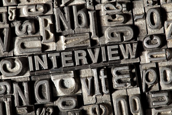 Old lead letters forming the word 'INTERVIEW'