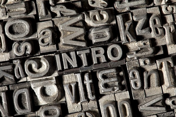 Old lead letters forming the word 'INTRO'