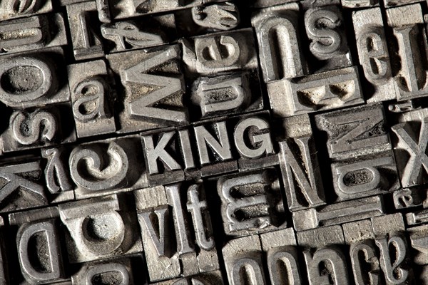 Old lead letters forming the word 'KING'