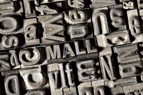 Old lead letters forming the word 'MALL'