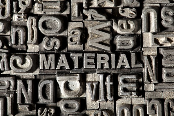 Old lead letters forming the word 'MATERIAL'
