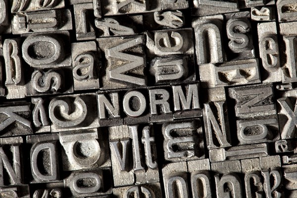 Old lead letters forming the word NORM