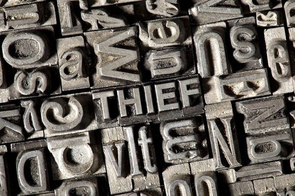 Old lead letters forming the word THIEF
