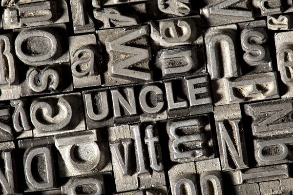 Old lead letters forming the word UNCLE