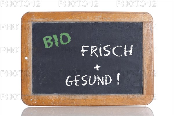 Old school blackboard with the words BIO - FRISCH + GESUND!