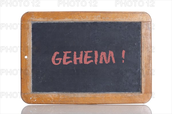 Old school blackboard with the word GEHEIM!