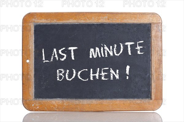 Old school blackboard with the words LAST MINUTE BUCHEN!