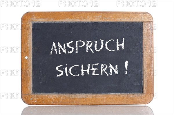 Old school blackboard with the words ANSPRUCH SICHERN!