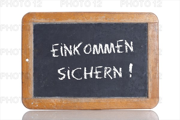 Old school blackboard with the words EINKOMMEN SICHERN!