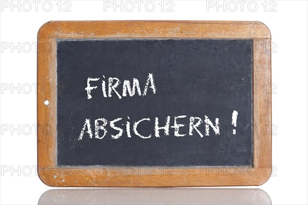 Old school blackboard with the words FIRMA ABSICHERN!