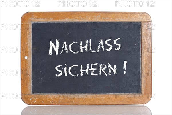 Old school blackboard with the words NACHLASS SICHERN!