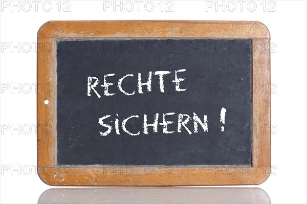Old school blackboard with the words RECHTE SICHERN!