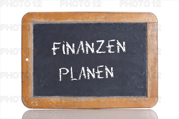 Old school blackboard with the words FINANZEN PLANEN