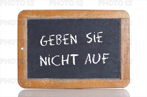 Old school blackboard with the words GEBEN SIE NICHT AUF