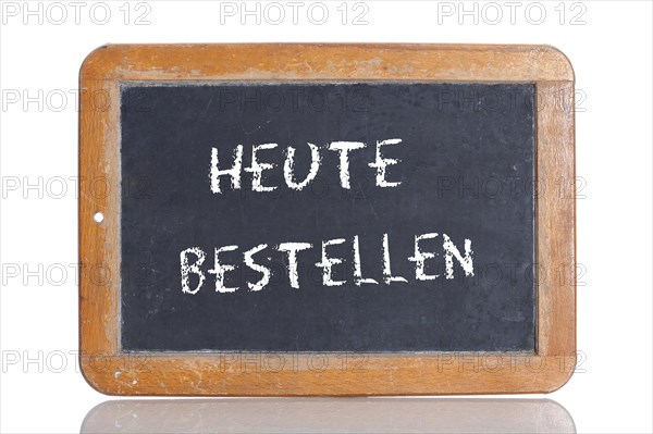 Old school blackboard with the words HEUTE BESTELLEN