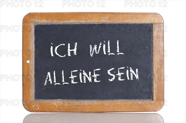 Old school blackboard with the words ICH WILL ALLEINE SEIN