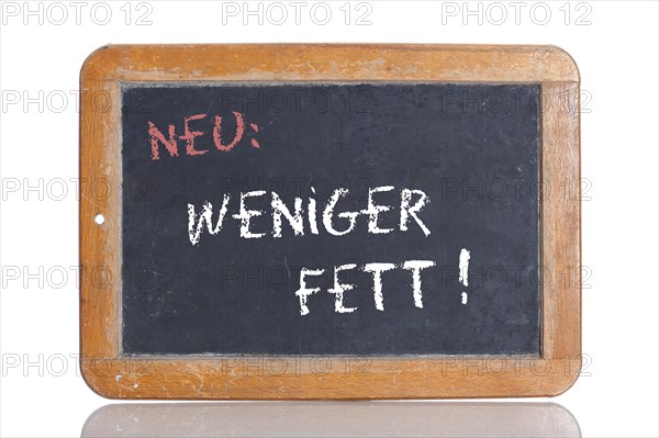 Old school blackboard with the words NEU: WENIGER FETT!