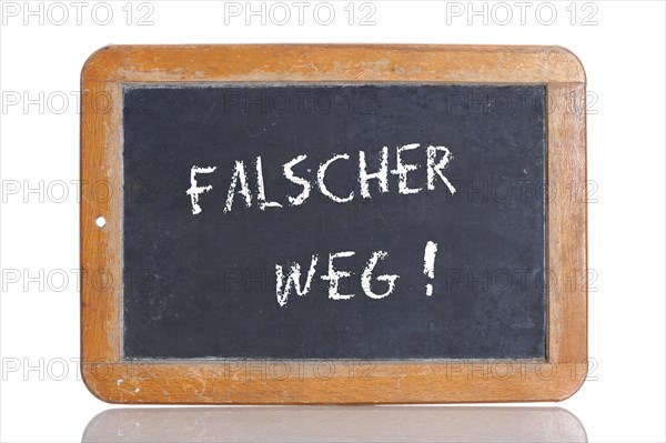 Old school blackboard with the term FALSCHER WEG
