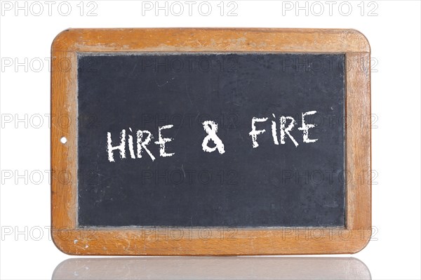 Old school blackboard with the term HIRE and FIRE