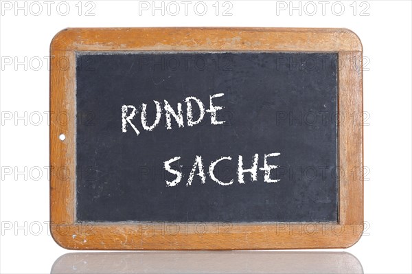 Old school blackboard with the term RUNDE SACHE