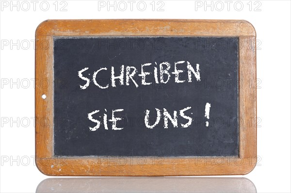 Old school blackboard with the term SCHREIBEN SIE UNS