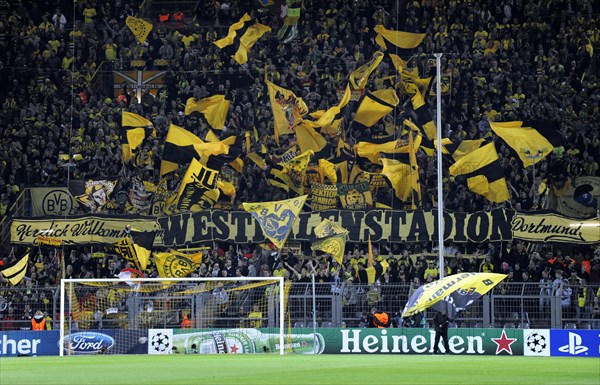 BVB fans in the south stand waving their flags before the start of the game