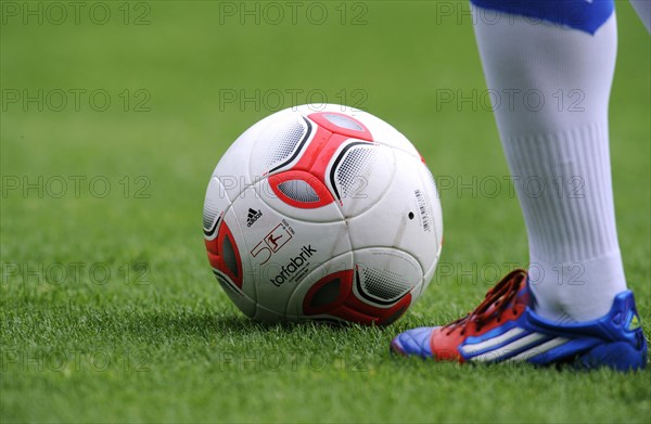 Players legs wearing adidas football boots and the adidas Torfabrik anniversary ball for the 50th Bundesliga season