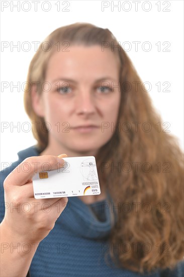 Woman holding a health insurance card