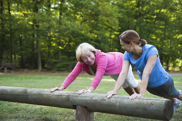 Women exercising on an outdoor fitness trail