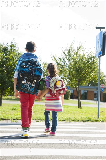 Children crossing a zebra crossing